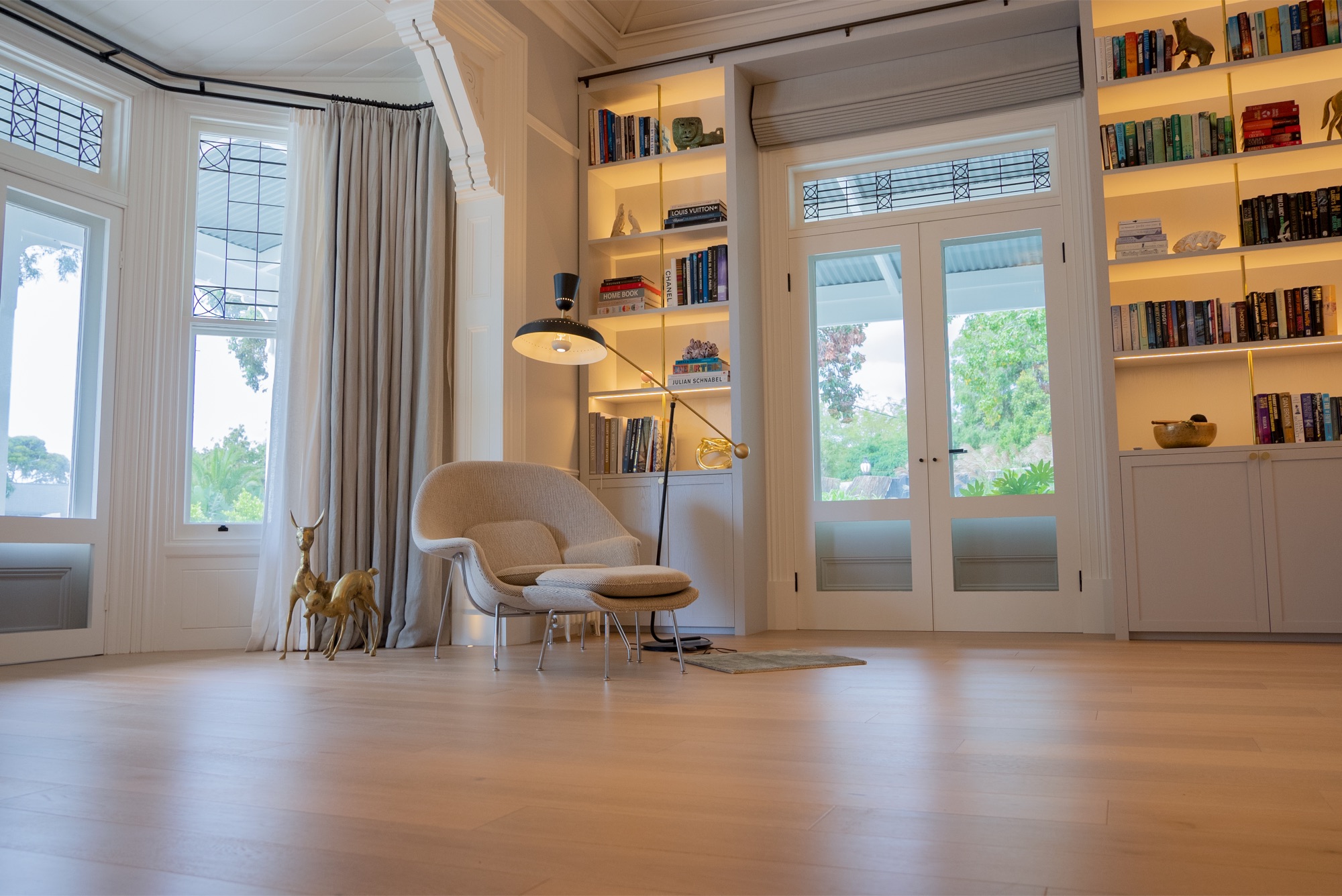 Dawn House &mdash; library with built-in bookshelves and marble fireplace